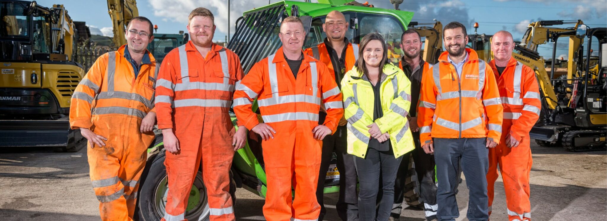 Group photo of the staff at CP Hire with the site depot in the background