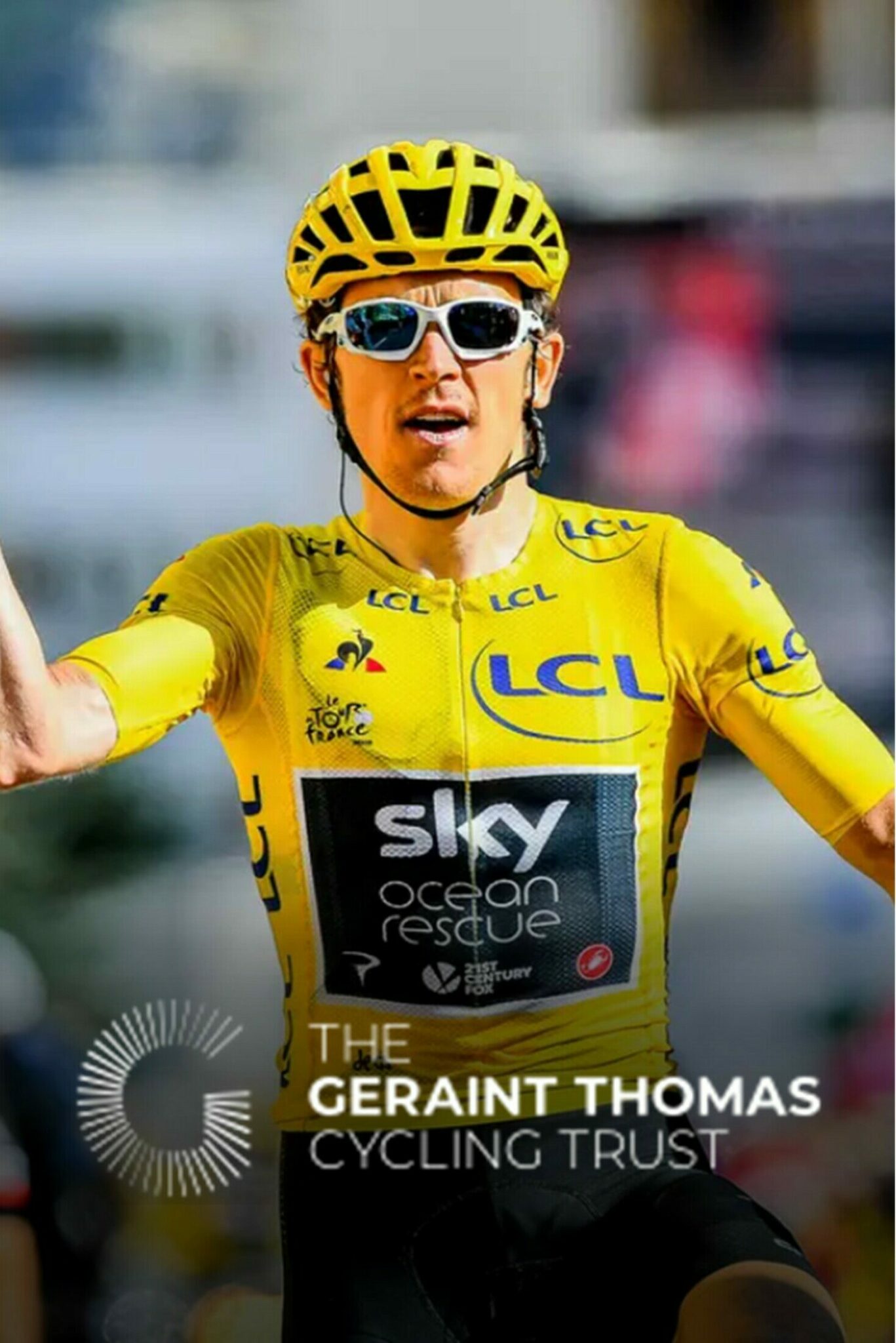 Geraint Thomas cycling with the charity logo at the bottom
